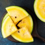 Cut yellow watermelon on table. Fresh summer food. Healthy nutrition